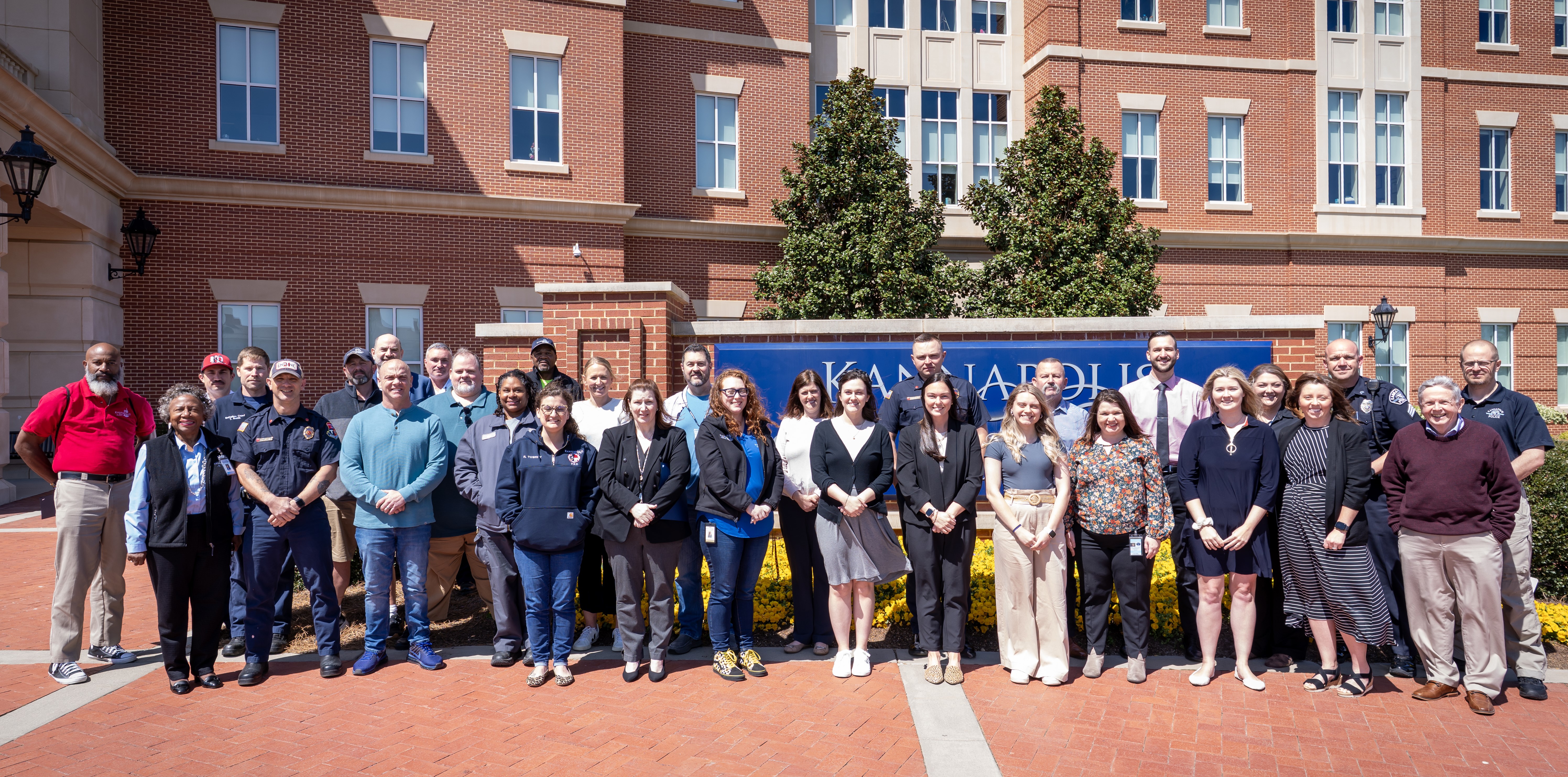 A group of people standing in front of a brick building smiling at the camera - SEEK Graduating Class 2025 A group of people standing in front of a brick building smiling at the camera - SEEK Graduating Class 2025